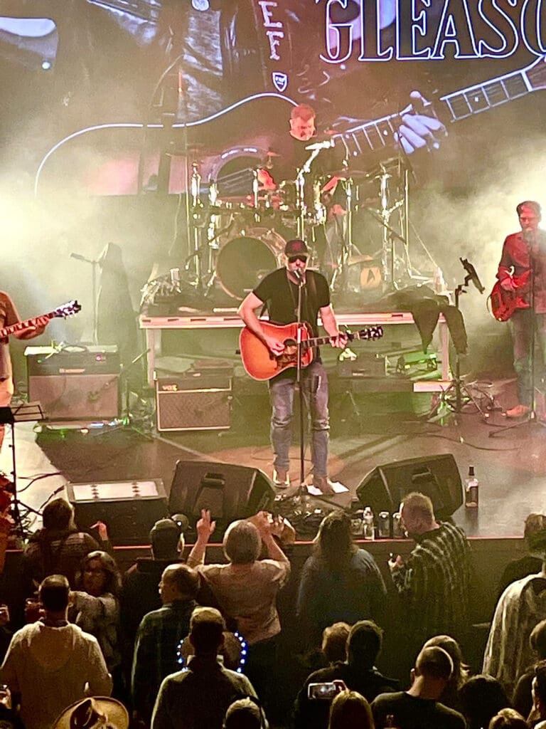 Lead Singer Playing Guitar on Stage - Gas City Performing Arts Center Lead singer playing guitar on stage